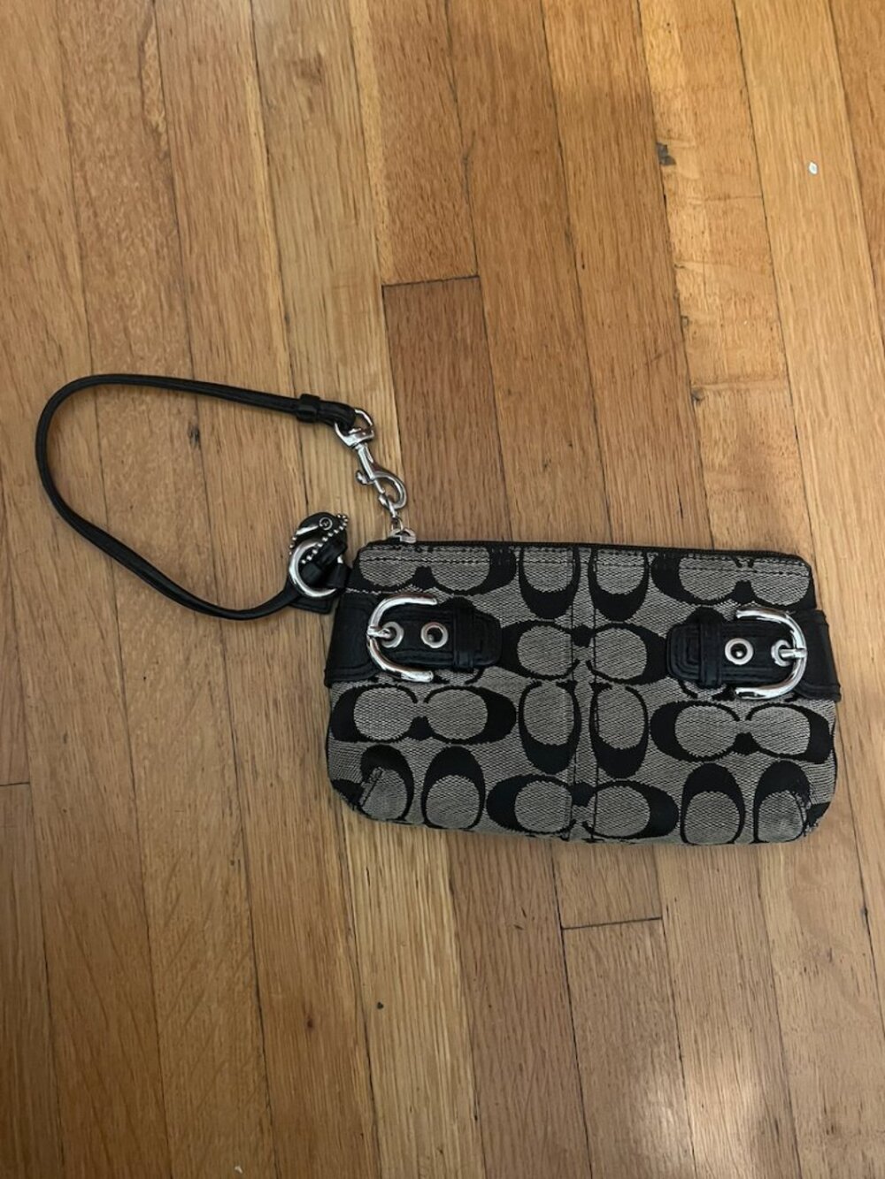 Coach wristlet with buckles